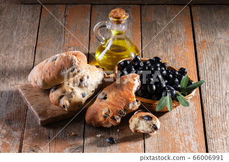 Traditional italian puccia breads with black olive Traditional italian puccia breads with black olive 66006991
