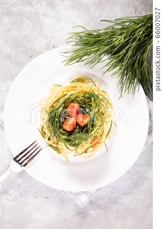 Spaghetti with agretti, a spring vegetable from Italy 66007027
