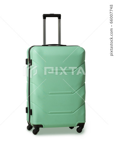 Green suitcase with retractable handle and wheels. Plastic travel luggage suitcase is reliable travel companion. Impressions of new places. Vacation concept. Isolated on white background 66007748