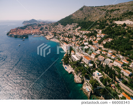 High aerial view from a drone on the coast of Dubrovnik and the old town in Croatia. High aerial view from a drone on the coast of Dubrovnik and the old town in Croatia. 66008343