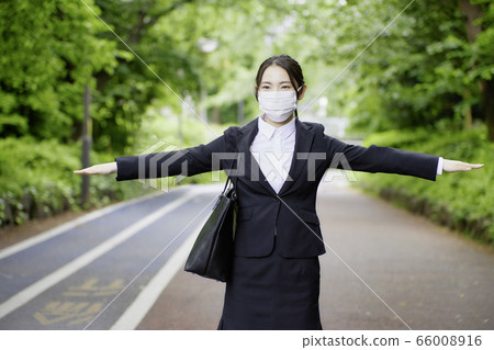 Young woman business mask social distance 66008916