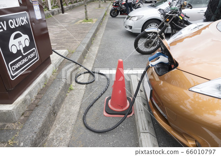 Image of electric car being charged Image of electric car being charged 66010797