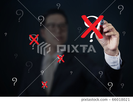 Businessman hand writing "Question" with red marker on transparent board, new business concept, studio shot 66018021