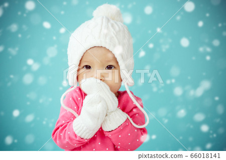 Portrait of asian baby with snow in blue background 66018141