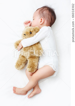 My Best Friend, Baby sleeping with her teddy bear (Soft focus and blurry) 66018382