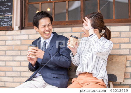 Fun Asian men and women joking and laughing 66018419