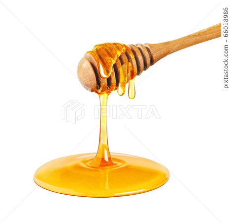 Honey dripping isolated on a white background, Dripped honey, Honey dipper Honey dripping isolated on a white background, Dripped honey, Honey dipper 66018986