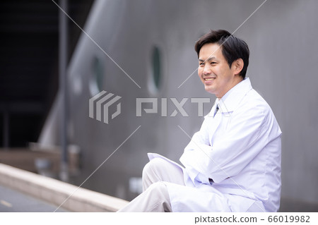 Asian man in white coat 66019982