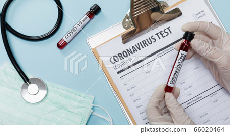 Hand holding testing patients blood samples for Coronavirus Outbreak (COVID-19) in the laboratory with doctor medical equipment, New coronavirus 2019-nCoV from Wuhan China concept,isolated long banner 66020464