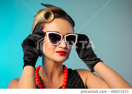 Beautiful young woman with pin-up make-up and Beautiful young woman with pin-up make-up and 66021031