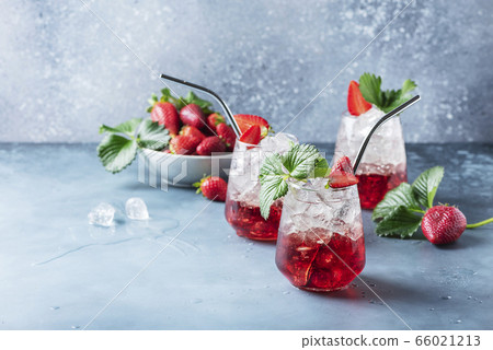 Red cocktail with ice and fresh strawberry Red cocktail with ice and fresh strawberry 66021213