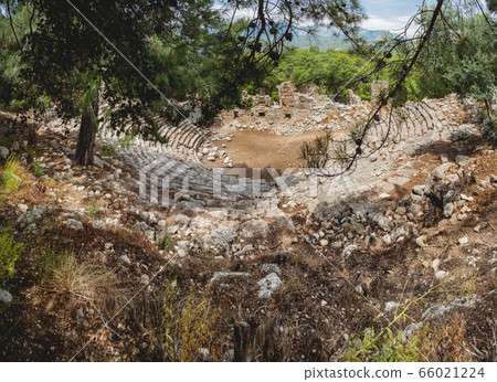 Ruins of amphitheatre of ancient Phaselis city. Panorama view on famous architectural landmark, Kemer district, Antalya province. Turkey. 66021224