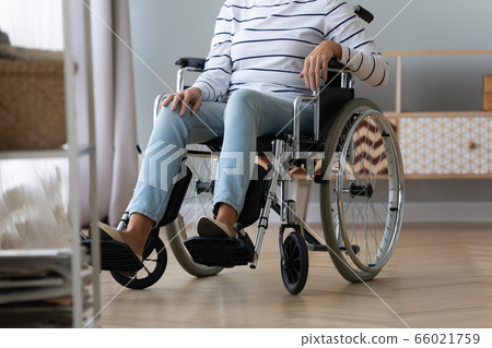 Unable to walk elderly disabled woman sitting in wheelchair Unable to walk elderly disabled woman sitting in wheelchair 66021759