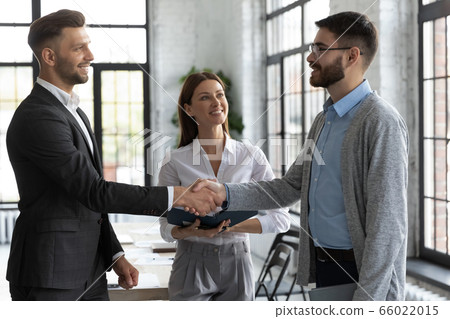Confident business people handshaking, greeting and acquaintance 66022015