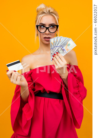girl in a red dress with a win of money and a meditation card with a layout 66022017