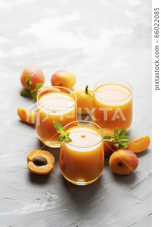 Fresh apricot juice on the marble table Fresh apricot juice on the marble table 66022085
