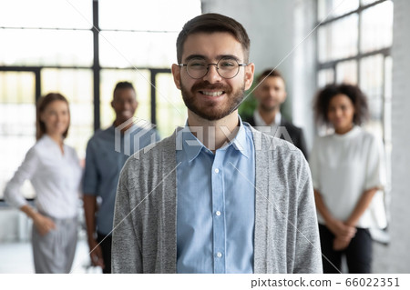 Head shot portrait smiling businessman executive with business team Head shot portrait smiling businessman executive with business team 66022351