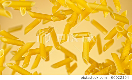 flying uncooked italian pasta penne on gold flying uncooked italian pasta penne on gold 66022394