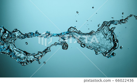 Water splash isolated on blue background 66022436
