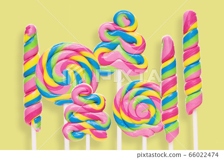 Set of colorful lollipops on yellow background. Set of colorful lollipops on yellow background. 66022474