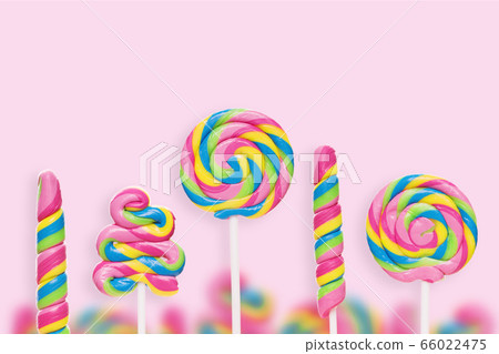 Five colored sweets of different shapes on a pink background Five colored sweets of different shapes on a pink background 66022475