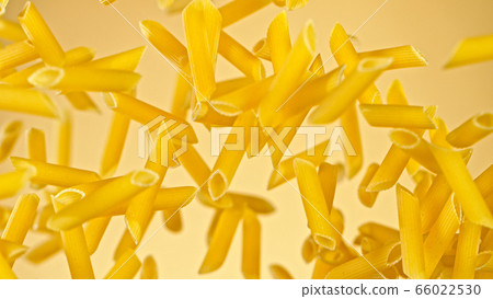 Freeze motion of flying uncooked italian pasta on Freeze motion of flying uncooked italian pasta on 66022530