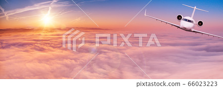 Small private jetplane flying above beautiful Small private jetplane flying above beautiful 66023223