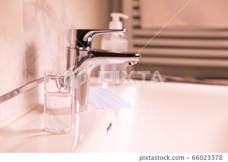 Modern bathroom with sink and disinfection fluid 66023378