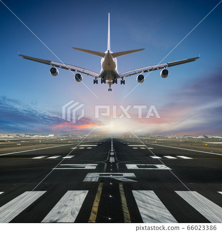 Airplane landing at the airport. Airplane landing at the airport. 66023386