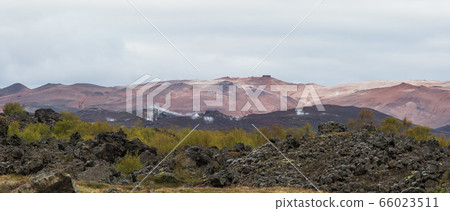 Typical icelandic landscape with black stones 66023511