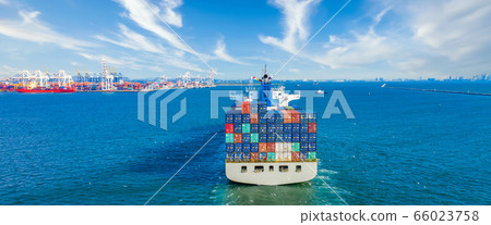 Aerial view container ship arriving in industrial 66023758