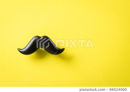 Father's day concept. Black moustache on yellow 66024000