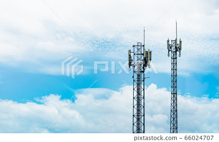 Telecommunication tower with blue sky and white 66024707