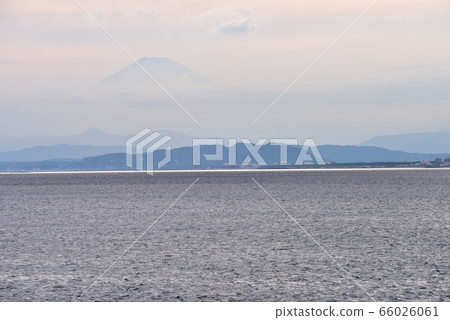 Mt.Fuji with clouds floating in the sky at Enoshima Higashihama 66026061