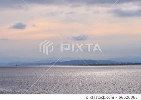 Mt.Fuji with clouds floating in the sky at Enoshima Higashihama 66026065