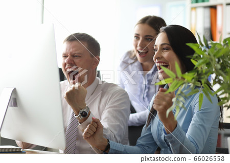 Delighted office workers being glad of their results 66026558