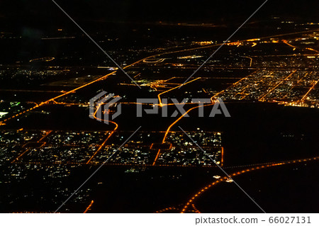 The view from the plane to the night city. The view from the plane to the night city. 66027131