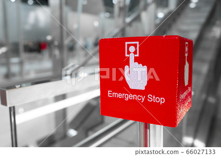 Big red escalator emergency stop button close up Big red escalator emergency stop button close up 66027133