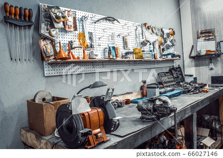 Workshop. Workbench with vise, grinder, tools kit Workshop. Workbench with vise, grinder, tools kit 66027146