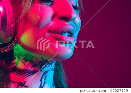 Portrait of young caucasian woman on purple background with copyspace, unusual and freaky appearance Portrait of young caucasian woman on purple background with copyspace, unusual and freaky appearance 66027539