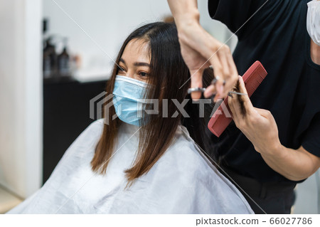 hairdresser cutting the hair to female client, hairdresser cutting the hair to female client, 66027786