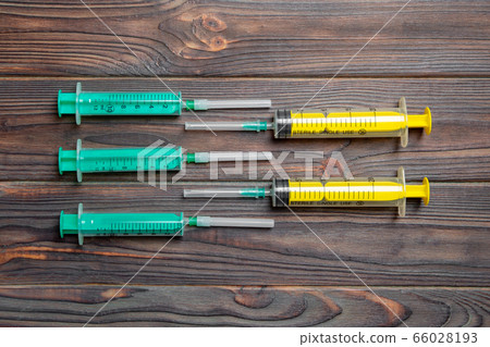 Top view of many syringes prepared for injection 66028193