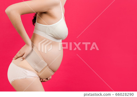 Cropped image of pregnancy belt dressed on Cropped image of pregnancy belt dressed on 66028290