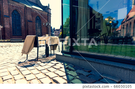 Restaurant table in the empty city of Riga 66030105