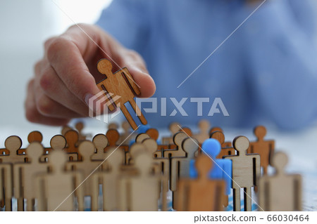 Close up of male hand that holding wooden figure 66030464