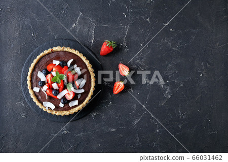 Vegan chocolate tart with nut and dates crust Vegan chocolate tart with nut and dates crust 66031462