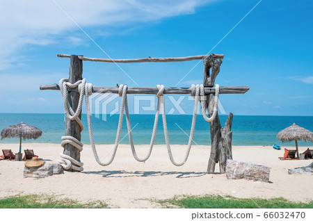 Two Chairs Under Parasol In Tropical Beach Two Chairs Under Parasol In Tropical Beach 66032470