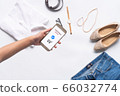 online shopping concept.close-up of hands using touch screen  66032774