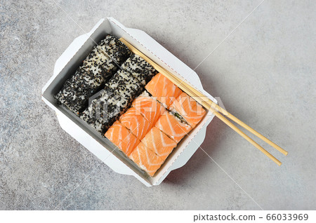 Philadelphia sushi with salmon and sesame in paper 66033969