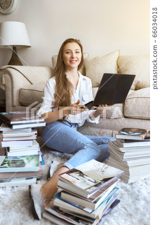 Young student watching lesson online and studying from home. Girl student studying from home Young student watching lesson online and studying from home. Girl student studying from home 66034018